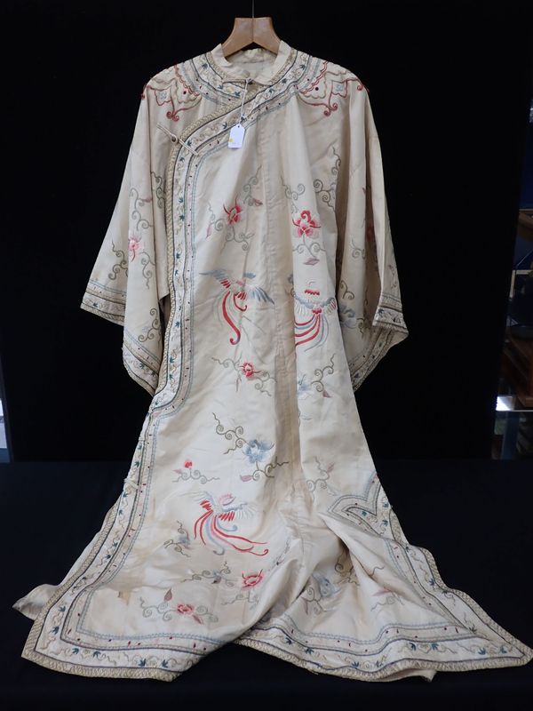 A CHINESE SILK ROBE, QING , EMBROIDERED WITH FLOWERS AND PHOENIX