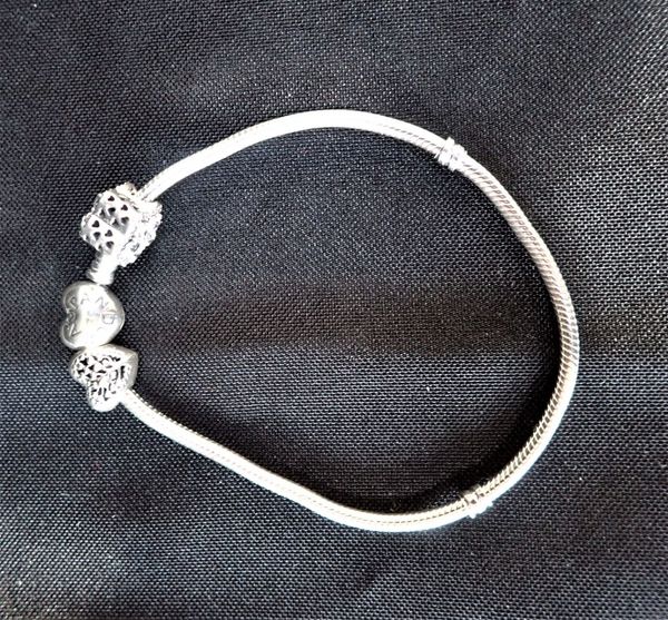 PANDORA: A SILVER BRACELET WITH TWO BEADS