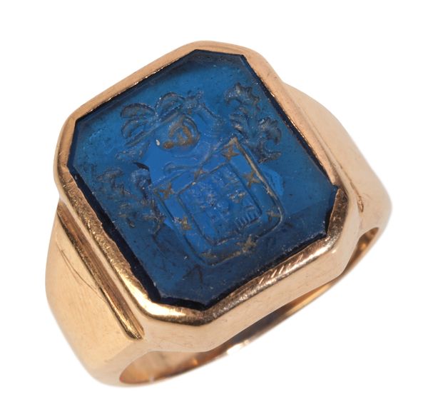 A CARVED SPINEL SIGNET RING