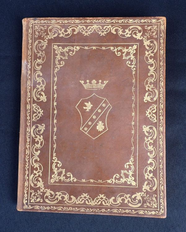 A VINTAGE ITALIAN LEATHER-BOUND NOTEBOOK, WITH GILT ARMORIAL