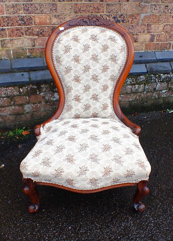 A VICTORIAN WALNUT SPOONBACK NURSING CHAIR