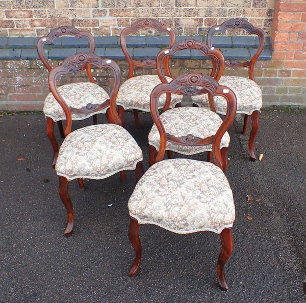 A SET OF SIX VICTORIAN WALNUT BALLOON BACK DINING CHAIRS