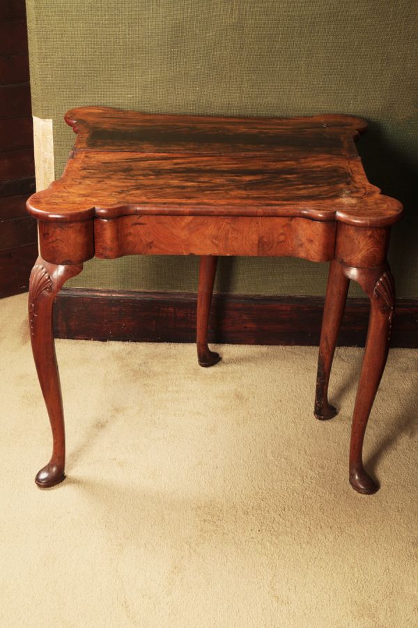 A GEORGE I WALNUT TEA TABLE