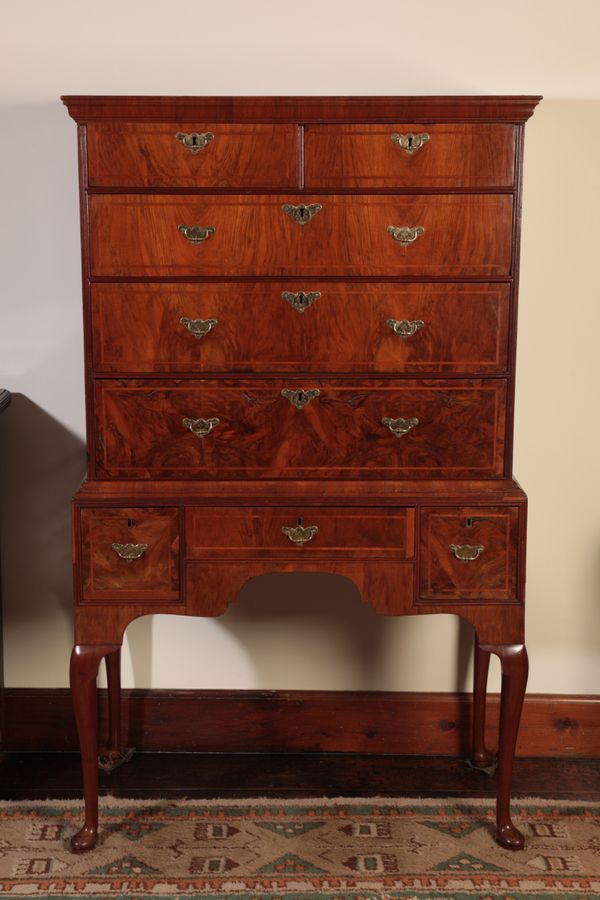 A GEORGE I WALNUT CHEST ON STAND