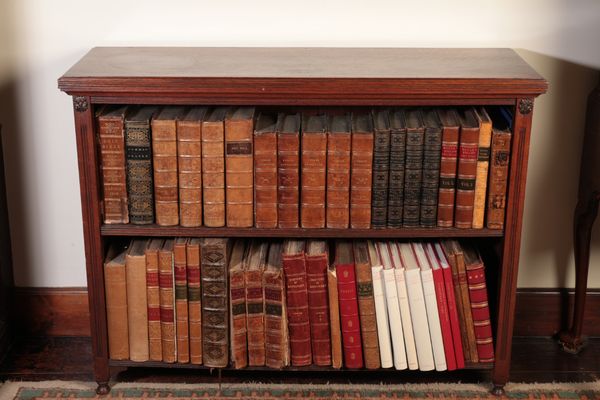 A LATE VICTORIAN OAK OPEN BOOKCASE