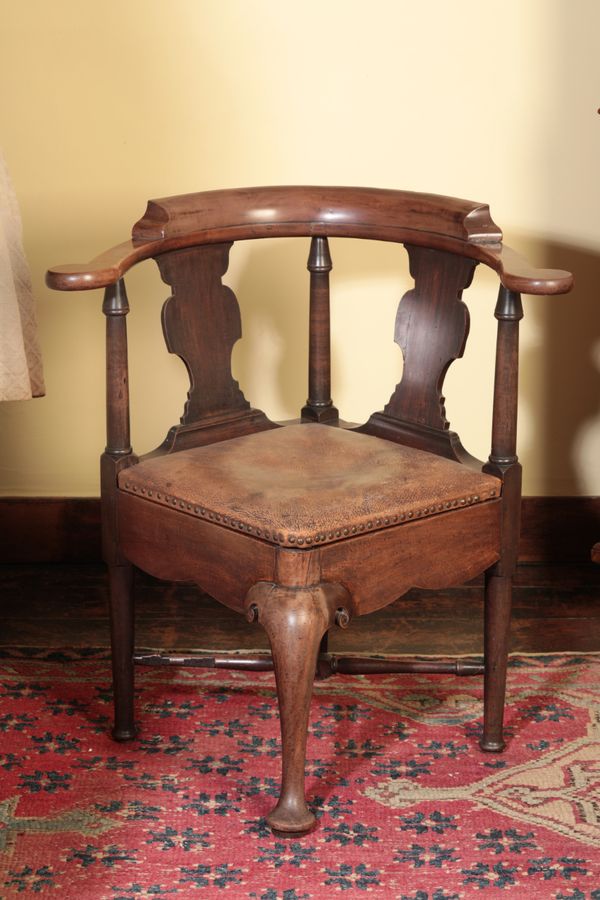 A GEORGE II MAHOGANY CORNER CHAIR