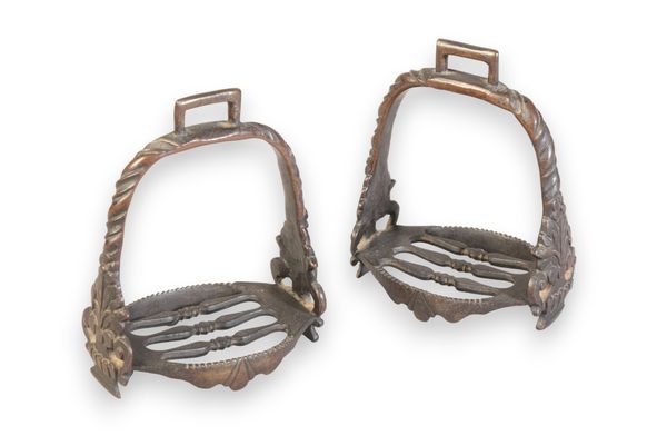 A PAIR OF BRONZE STIRRUPS