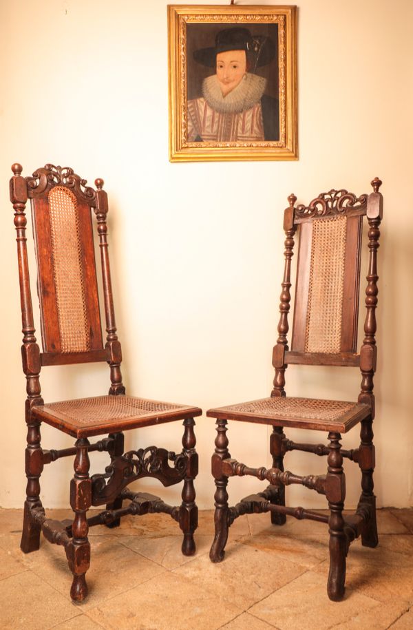 A WILLIAM AND MARY WALNUT AND STAINED WOOD ELBOW CHAIR