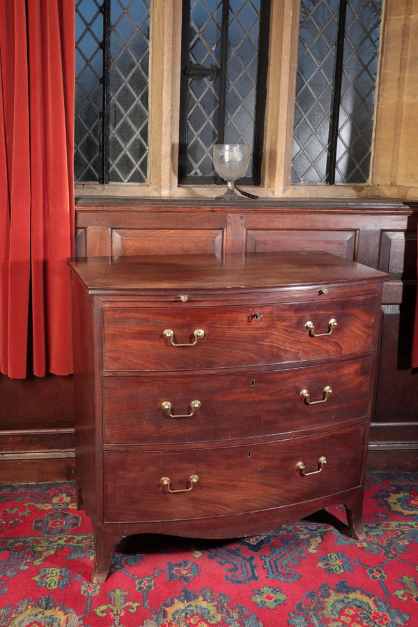 A PAIR OF LATE GEORGE III MAHOGANY BOWFRONT CHESTS OF DRAWERS