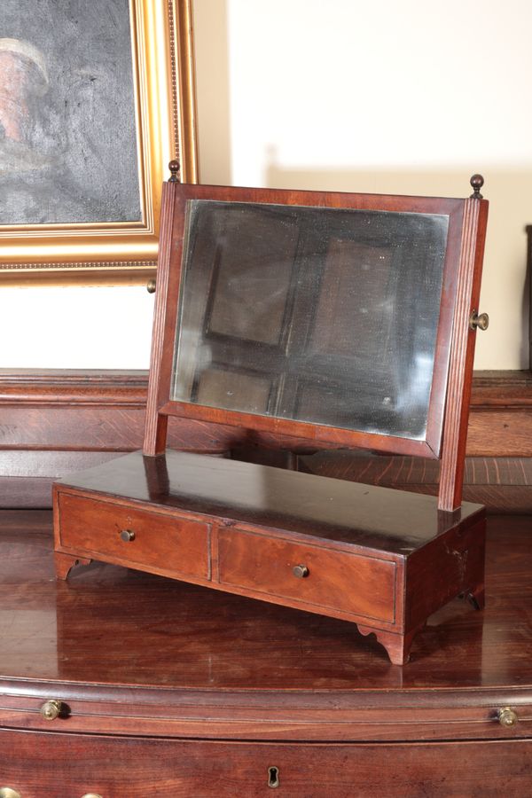 A LATE GEORGE III MAHOGANY DRESSING MIRROR