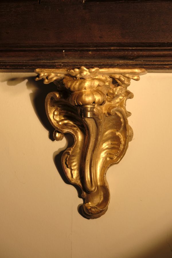 A PAIR OF ROCOCO GILTWOOD WALL BRACKETS