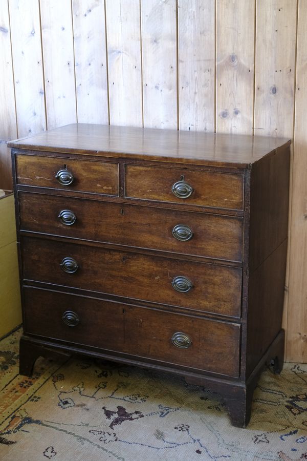 A GEORGE III CHEST OF DRAWERS