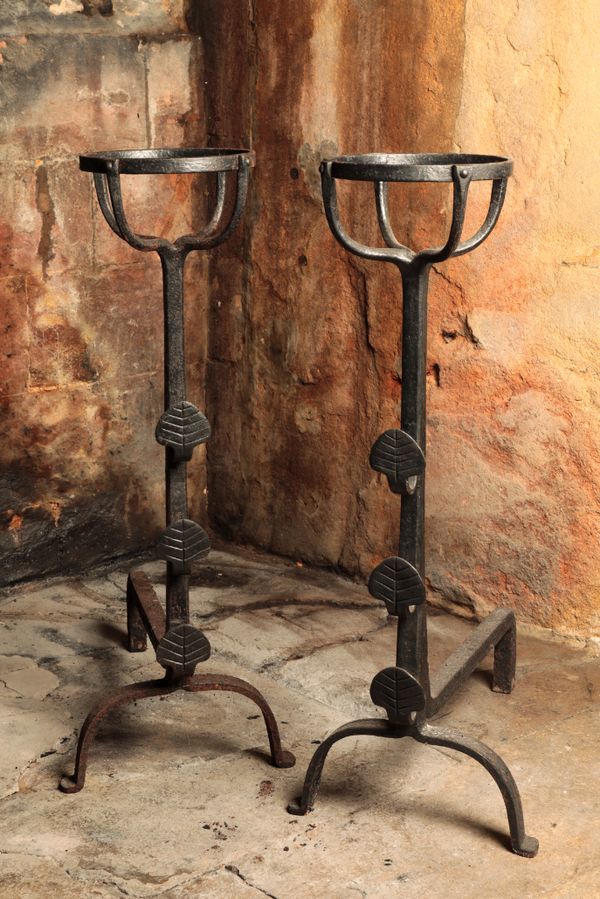 A PAIR OF WROUGHT IRON ANDIRONS