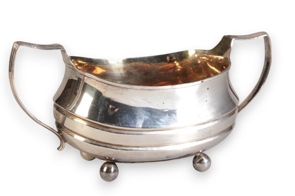 A GEORGE III SILVER TWO-HANDLED SUGAR BASIN