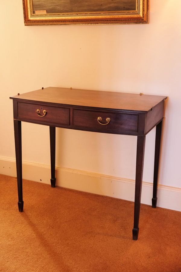 A GEORGE III MAHOGANY BOWFRONT DRESSING TABLE