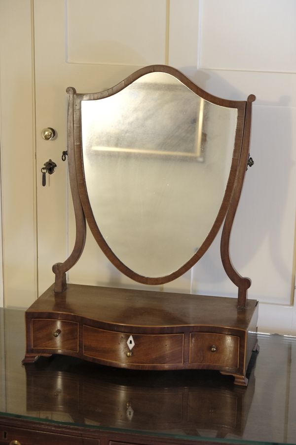 A GEORGE III SHIELD-SHAPED TOILET MIRROR