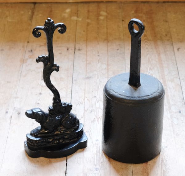 A BLACK-PAINTED CAST IRON DOORSTOP