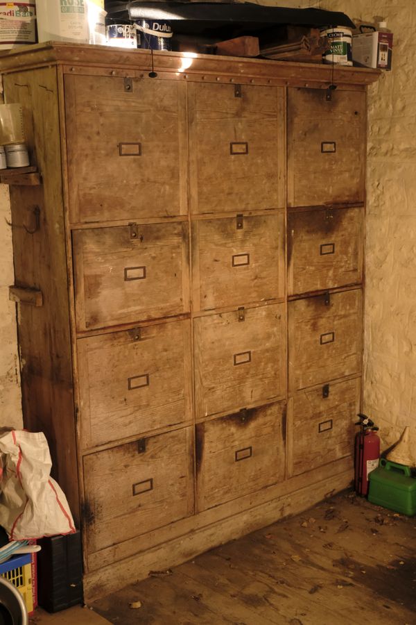 A WOODEN OFFICE CABINET