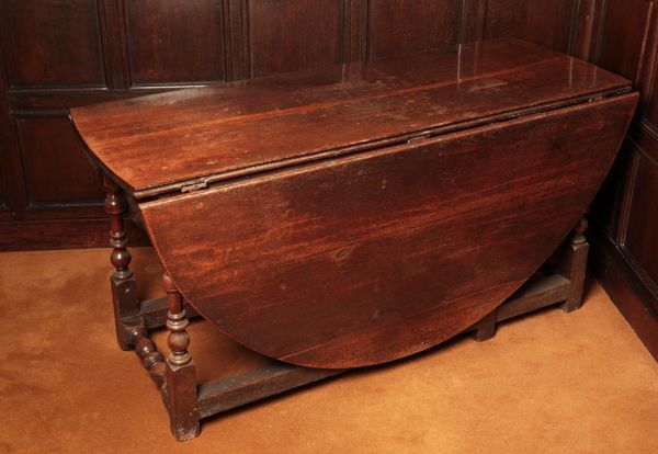 A CHARLES II OAK GATELEG TABLE