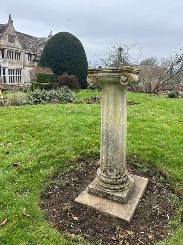 A COMPOSITE STONE PLINTH