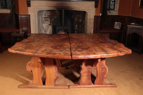 A CONTEMPORARY BURR ELM DINING TABLE