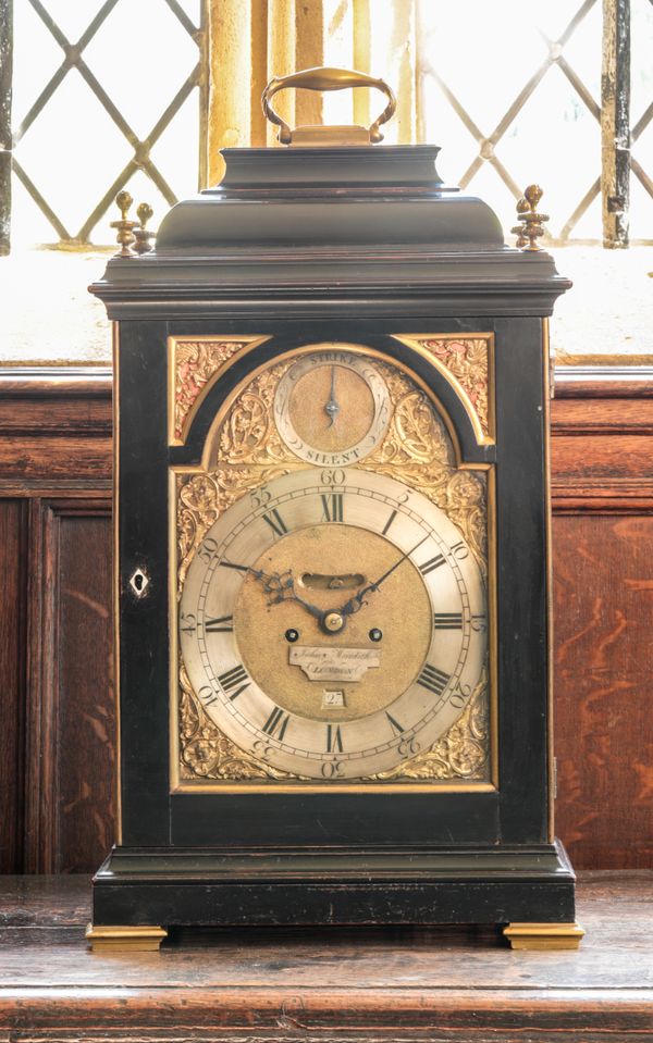 A GEORGE III EBONISED BRACKET CLOCK