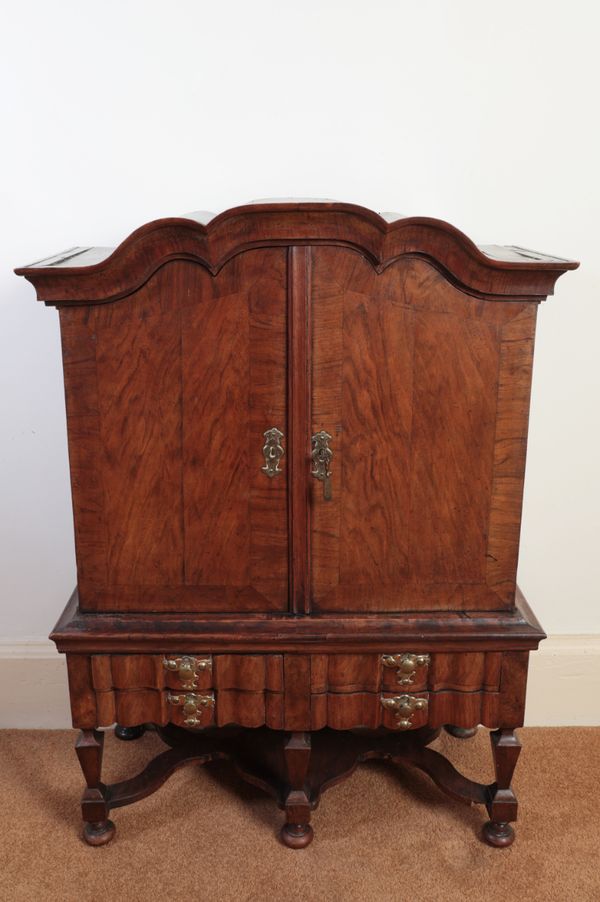 A DUTCH MINIATURE WALNUT CABINET ON STAND