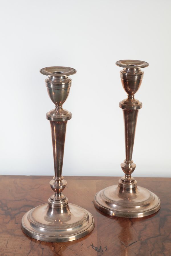 A PAIR OF GEORGE III SHEFFIELD PLATE CANDLESTICKS