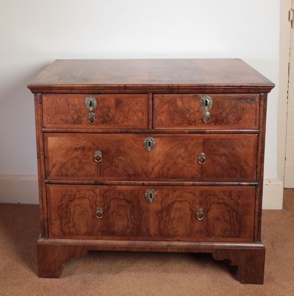 A QUEEN ANNE WALNUT CHEST OF DRAWERS