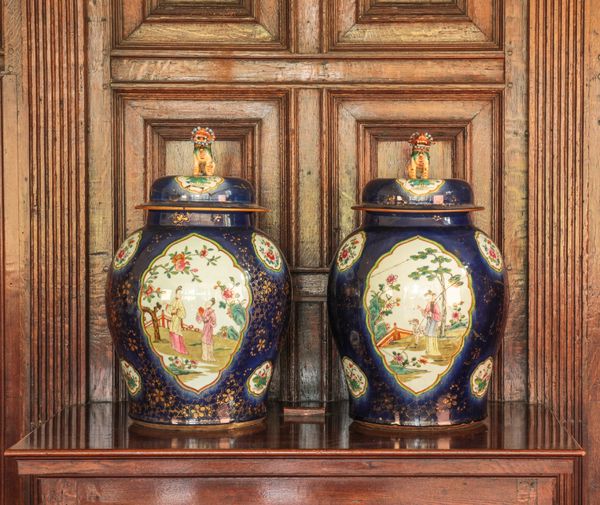 A PAIR OF CHINESE FAMILLE VERTE/ROSE VASES AND COVERS