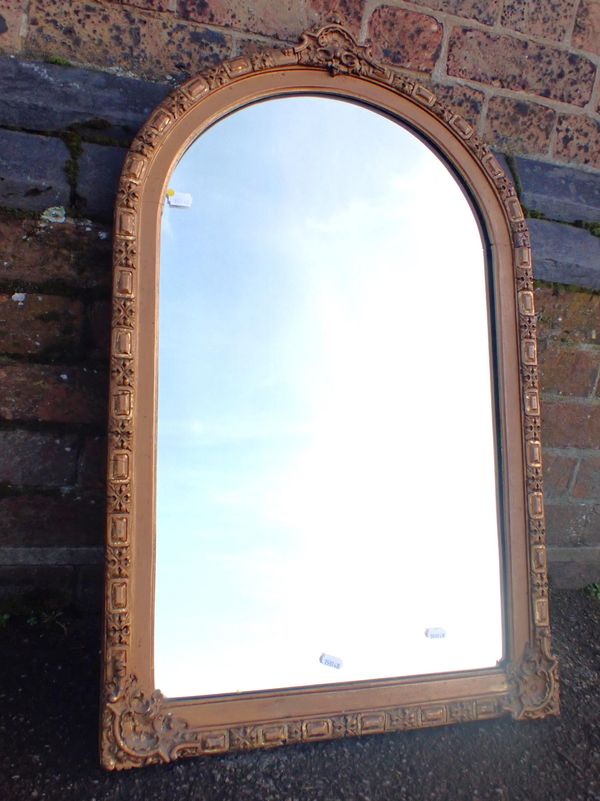 A VICTORIAN GILT WALL MIRROR