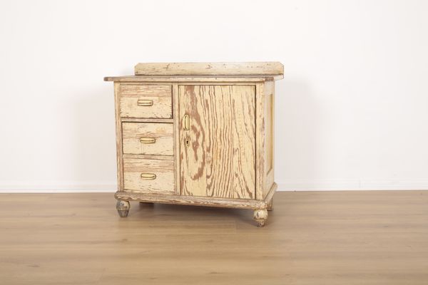 A PINE CABINET WITH DISTRESSED PAINT EFFECT