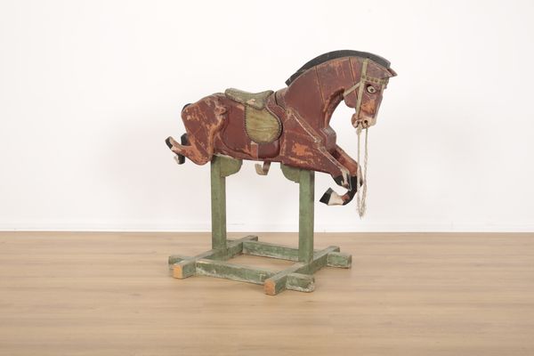 A CHILDREN'S TOY OR FAIRGROUND POLYCHROME PAINTED WOODEN HORSE