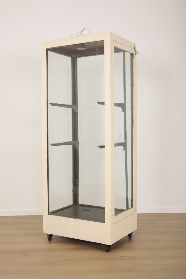 A WHITE PAINTED WOODEN SHOP DISPLAY CABINET
