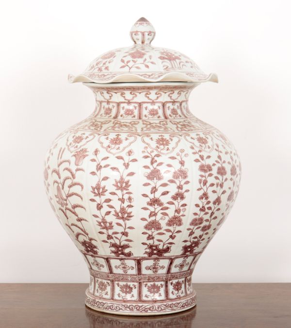 A LARGE CHINESE COPPER RED VASE AND COVER