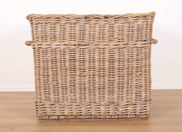 A LARGE WICKER LOG BASKET