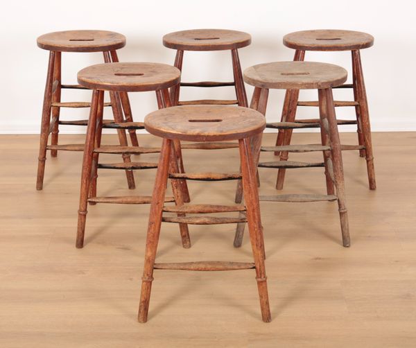 A GROUP OF SIX COUNTRY ELM STOOLS