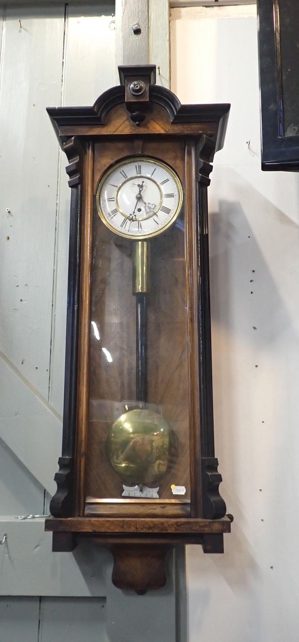 A WALNUT-CASED VIENNA STYLE WALL CLOCK