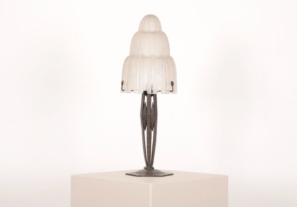 AN ART DECO LAMP WITH EDGAR BRANDT STYLE BASE