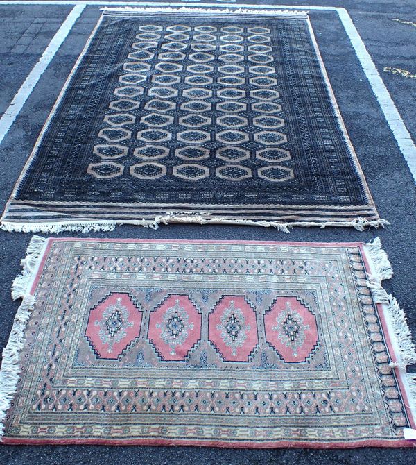 A PAKISTAN BOKHARA RUG, PINK GROUND