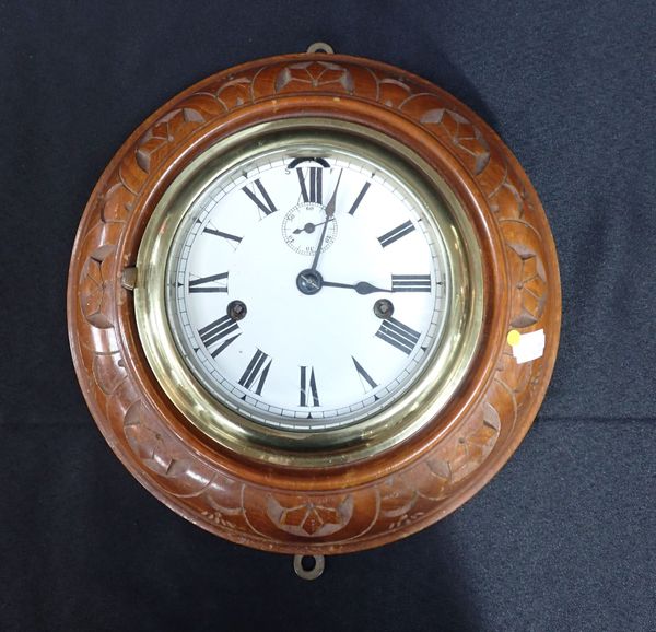 A SHIP'S STYLE WALL CLOCK, WITH CARVED CASE