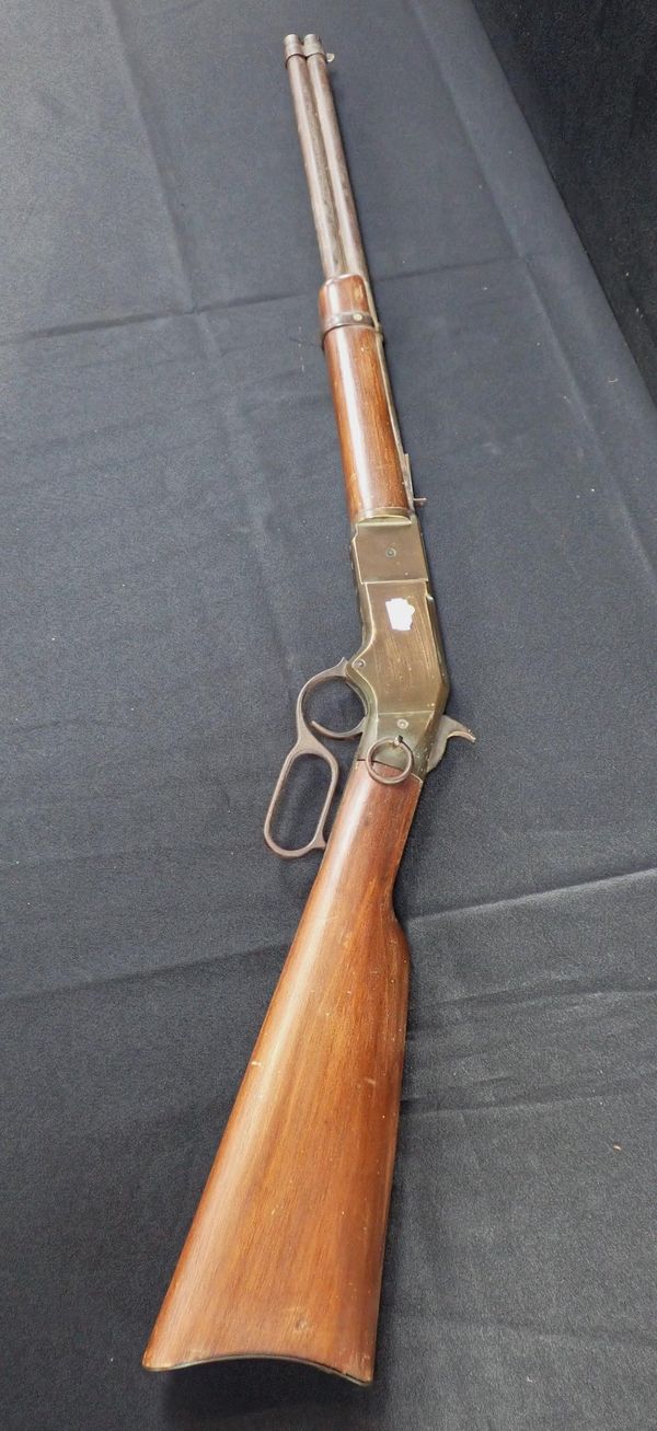 A REPLICA MODEL OF A WINCHESTER RIFLE