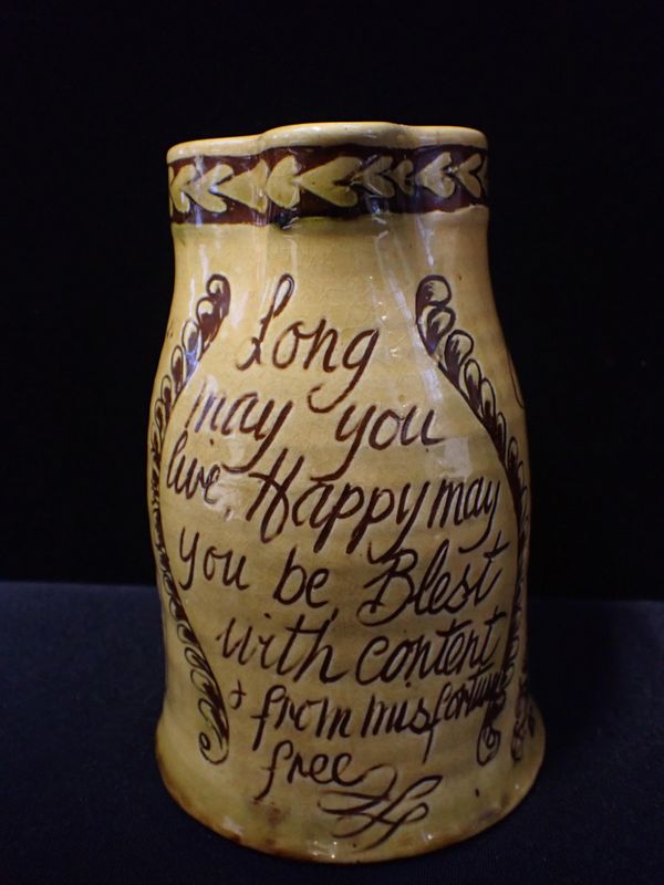 MARY WONDRAUSCH (ATTRIBUTED TO): A SLIPWARE MARRIAGE JUG