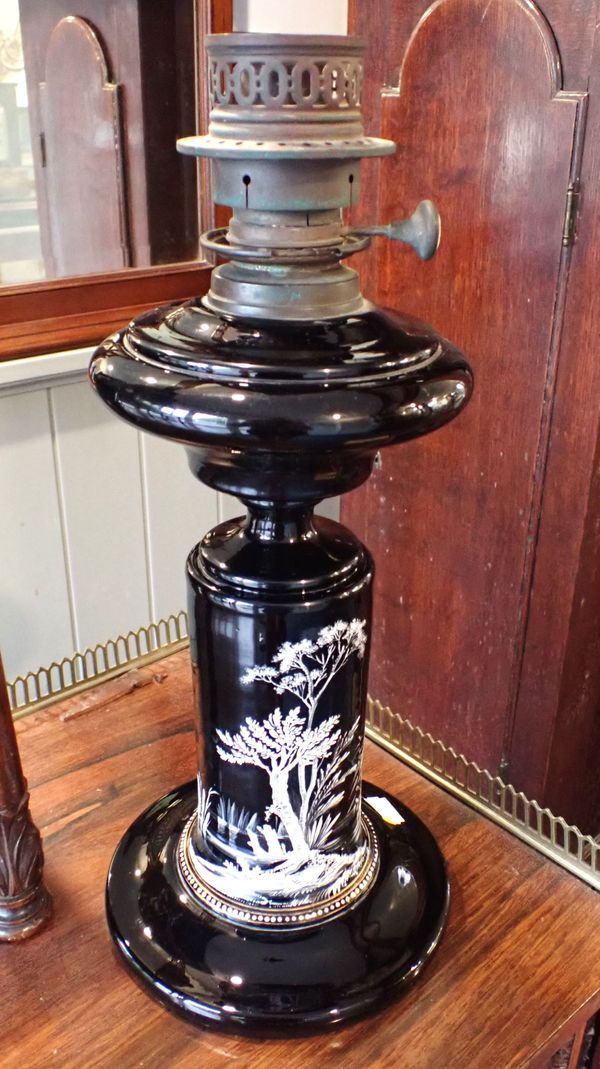A 19TH CENTURY BLACK OPAQUE GLASS OIL LAMP: THE SILBER LIGHT COMPANY