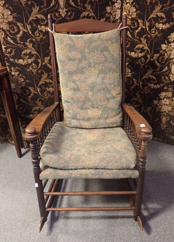 AN ARTS AND CRAFTS STYLE ROCKING CHAIR