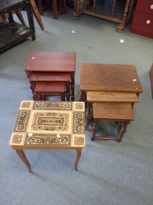 A NEST OF THREE RECTANGULAR OAK TABLES