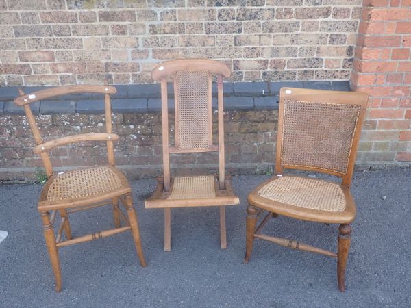 A FOLDING 'STEAMER' CHAIR, WITH CANED PANELS