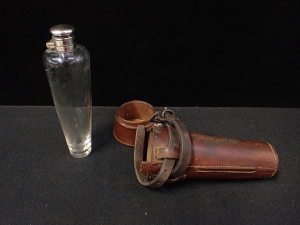 A LEATHER-CASED HUNTING SADDLE FLASK