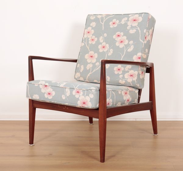 A MID CENTURY SCANDINAVIAN ROSEWOOD ARMCHAIR