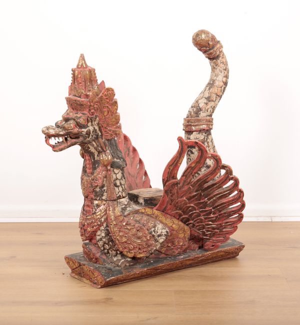 A SOUTH EAST ASIAN CARVED AND POLYCHROME PAINTED DRAGON